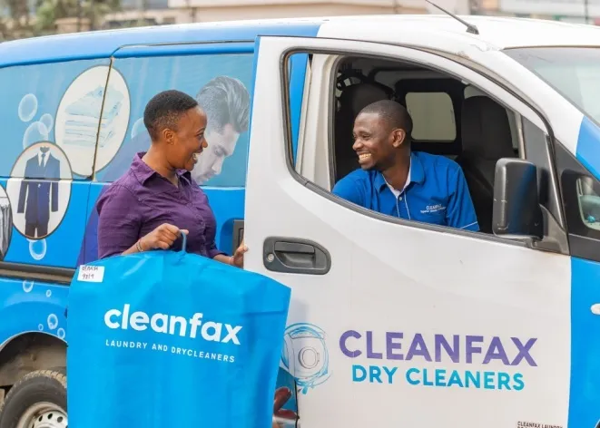 Cleanfax Laundry branded van and staff with laundry bag in Nairobi
